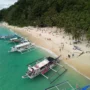 White sand Seven Commando Beach El Nido Philippines turquoise water palm trees